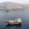 This aerial photograph shows boats anchored off Oman's northern Musandam Peninsula near the Strait of Hormuz on June 27, 2026.