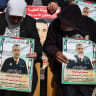 People lift placards bearing portraits of Gazans currently detained by Israel, including Dr. Hussam Abu Safiya, during a protest in solidarity with them in Ramallah city in the West Bank on January 14, 2025. 