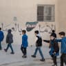 Schoolchildren walk back to their classroom at the Zamalka mixed school on April 16, 2025; illustrative.