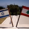 Israeli and Lebanese flags on display at a monument called the ‘Good Fence’ in the northern town of Metula, bordering Lebanon, on June 18.