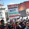 A PLACARD reading ‘United Kingdom not Divided Kingdom’ is pictured during a march against the far Right, in central London, in 2026.
