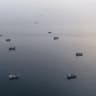 This aerial photograph shows boats anchored off Oman's northern Musandam Peninsula near the Strait of Hormuz on June 27, 2026.