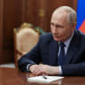 In this pool photograph distributed by the Russian state agency Sputnik, Russia's President Vladimir Putin attends a meeting with VTB bank chief in Moscow on July 3, 2026.