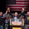 Sen. Bernie Sanders (center) stands with Troy Jackson (left), who is now running for the Democratic nomination for U.S. Senate, and Graham Platner (right), who was then the Democrats' presumptive nominee, during Sanders' “Fighting Oligarchy” tour, May 24, 2026, in Orono, Maine. 