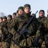 German Bundeswehr troops march during a public ceremony to mark the expansion of Germany's Lithuania military commitment on February 4, 2026.