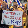 Mickey Gitzin, right, and Daniel Sokatch take part in a pro-democracy demonstration in Tel Aviv.