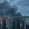 mokes rises after a Russian ballistic missile strike hit a roadway in Kyiv's Darnytskyi district, where a traffic-light control electrical cabinet caught fire and windows were shattered in nearby residential buildings on July 11, 2026 in Kyiv, Ukraine. 