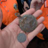 Antique pocket watch and ruble coins discovered by Chabad summer camp kids in the town of Lyubavichi, Russia, July 12, 2026.