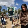 Bereaved families, friends, and soldiers stand still as a two-minute siren sounds across Israel, marking Memorial Day which commemorates the fallen Israeli soldiers and victims of terror at the site of the Nova music festival massacre, in Re'im forest, near the Israel-Gaza border, April 21.