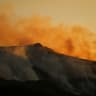 Smoke billows from a wildfire that has been ravaging mountain vegetation for several days, amid a heatwave affecting a large part of the country, at sunset near Die in the Drome department, France, July 9, 2026.