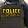 An Immigration and Customs Enforcement (ICE) agent stands near Delaney Hall which is being used as an Immigration and Customs Enforcement detention center on in Newark, New Jersey, on May 26, 2026.