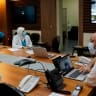 Director of the Rafic (Rafiq) Hariri University Hospital, Firass Abiad, heads a videoconference meeting with medics inside the coronavirus department in the capital Beirut, on July 28, 2020; illustrative