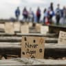 A sign is pictured while people take part in the annual international "March of the Living" at the former Auschwitz II-Birkenau death camp, to pay tribute to the millions of Jews murdered by the Nazis during World War Two, in Brzezinka, Poland, April 14, 2026. 