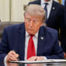 US President Donald Trump signs an executive order related to Utah protected lands in the Oval Office at the White House in Washington, DC, US, July 13, 2026.
