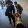 POLICE ARE seen dragging an ultra-Orthodox protester away during a demonstration against a cafe operating on Shabbat while secular protesters demonstrate in support of the cafe in central Jerusalem, on July 11, 2026.