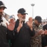 IRGC CHIEF Ahmad Vahidi (center in black) prays with mourners for Iran’s slain supreme leader Ayatollah Ali Khamenei during the second day of funeral ceremonies at the Grand Mosalla in Tehran, in July 2026.