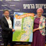 Finance Minister Bezalel Smotrich and National Missions Minister Orit Strock hold a map of the West Bank as they celebrate the Knesset Security Cabinet approval of their NIS1.3M budget to build 34 new settlements throughout the territory. 