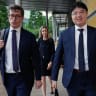 Bloomberg journalist Low De Wei and Senior Executive Editor John Fraher leave the Supreme Court in Singapore April 7, 2026.