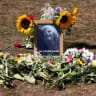 Flower tributes lie next to a portrait of 78-year-old former government minister Ann Widdecombe after she was found dead, as the police investigation continues, in Dartmoor National Park in Haytor, Britain, July 11, 2026.