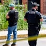 Police officers work at a scene of a shooting involving US Immigration and Customs Enforcement (ICE) in Biddeford, Maine, US July 13, 2026. 