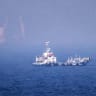  UAE-IRAN-US-ISRAEL-WAR This picture shows ships sailing near the Strait of Hormuz off the eastern coast of the United Arab Emirates at Khor Fakkan on July 13, 2026. 