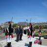 France's President Emmanuel Macron and Charles Dreyfus grandson of Alfred Dreyfus pay tribute in front of the 3.5-meter (12ft) bronze statue made in 1985 by French artist Louis Mitelberg aka Tim.