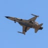 An Iranian Northrop F-5E Tiger II fighter jet performs a flyby over mourners taking part in a funeral procession for Iran's slain supreme leader Ali Khamenei and members of his family on July 9, 2026.