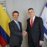 Colombia’s incoming foreign minister, Omar Bula Escobar (L), and Foreign Minister Gideon Sa'ar shake hands after agreeing to work to repair Israel and Colombia's relations.