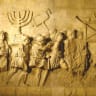 MODERN REPLICA of the Arch of Titus relief depicting the spoils of the Second Temple, carried in a triumphal procession through Rome following its conquest of Jerusalem in 70 CE.