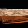 A microphoto taken by the South-African-born sculptor is a of a flesh-colored surface with a tiny elephant on it. When viewed though a microscope nearby shows it’s a human finger and a tiny pachyterm, which illustrates how tiny it is.