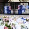 Local residents, both Jewish and non-jewish visit the inundated flower memorial next to Bondi Pavilion to pay their respects at Bondi Beach on December 16, 2025 in Sydney, Australia.