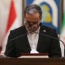 Iranian Foreign Minister Abbas Araghchi looks down at notes during a joint press conference with his Iraqi counterpart during their joint press conference following a meeting in Baghdad on June 28, 2026.