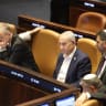 Prime Minister Benjamin Netanyahu and Communications Minister Shlomo Karhi are seen in the Knesset plenum during a vote on the minister's communications reform, in Jerusalem, July 16, 2026