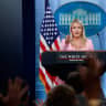 Reporters raise hands as White House Press Secretary Karoline Leavitt holds a press briefing in the James S. Brady Press Briefing Room at the White House in Washington, DC, US, July 16, 2026. 