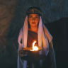 A Yazidi woman holds a flame during the Charshama Sor Red New Year ceremony at the Lalish temple in Iraq in April. For a community repeatedly driven from its ancestral homes and subjected to forced conversions, religious tradition has become an enduring expression of survival and continuity.