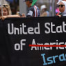 People hold a sign that says United States of Israel in support of Palestinians during the nation's 250th anniversary celebration on July 4, 2026 in Washington.