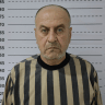 Former Syrian army Col. Ahmad Habib Ali is seen in detention following his arrest by Syrian authorities. Syria's Interior Ministry says he supervised the production of sarin-filled aerial bombs used in attacks between 2013 and 2017.