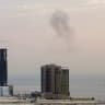 Smoke rises after a drone was intercepted during early morning hours in Manama, Bahrain, July 14, 2026. 