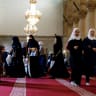Women prepare for Eid al-Adha prayers at the Umayyad Mosque in Damascus, Syria, May 27, 2026.