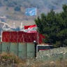Flags, including a Lebanese flag and a United Nations (UN) flag, fly at a UN post in Lebanon, after Israel and Lebanon signed a framework agreement following US-mediated talks, as seen from northern Israel, June 27, 2026. 