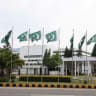 Pakistani flags flutter near the Parliament House, as delegations from the United States and Iran are expected to hold peace talks, in Islamabad, Pakistan, April 11, 2026.