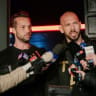 Andrew Tate and his brother Tristan Tate talk to the media outside their residence on March 23, 2025 in Bucharest, Romania. 