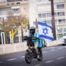 A WOLT delivery man with an Israeli flag during the ongoing war between Israel-US and Iran.March 15, 2026.