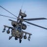 A Dutch Boeing AH-64 Apache attack helicopter takes part in a combat display during a press day for the military exercise Aurora 26 at the Revingehed training field outside Lund in Skane, Southern Sweden on April 29, 2026. 