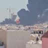 Smoke billows near the oil facility in Mangaf, Kuwait, July 18, 2026.