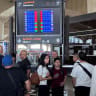 Illustrative People stand in front of a flight information display screen showing information about delayed and cancelled flights, at Queen Alia International Airport in Amman, Jordan June 13, 2025.