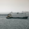  Crude oil tankers, bulk carriers and vessels sit anchored around Qaboos Port on June 22, 2026 in Muscat, Oman.