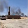 Thick black smoke is seen rising from King Hussein International Airport in Aqaba, Jordan, after it was hit by Iranian ballistic missiles on July 19, 2026..