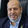 Khalil al-Hayya, senior leader and top Hamas legislative candidate, smiles during an interview with AFP at his office in Gaza City on April 21, 2021;illustrative