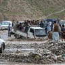People use a mini truck to cross a flooded road in the Argo district of Afghanistan's Badakhshan province on June 4, 2026; Illustrative.